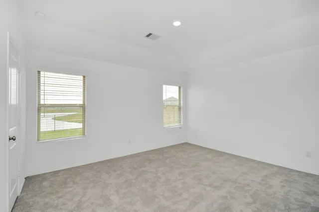 an empty room with windows