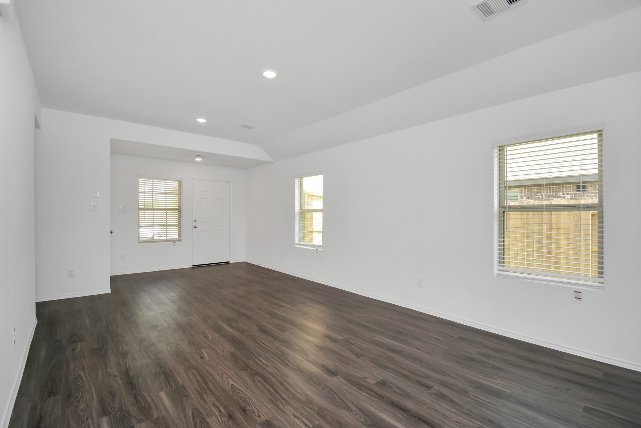 5035 Caledonia Lake Lane Rosharon, TX 77583 - Photo 26 of 37 an empty room with wooden floor and windows