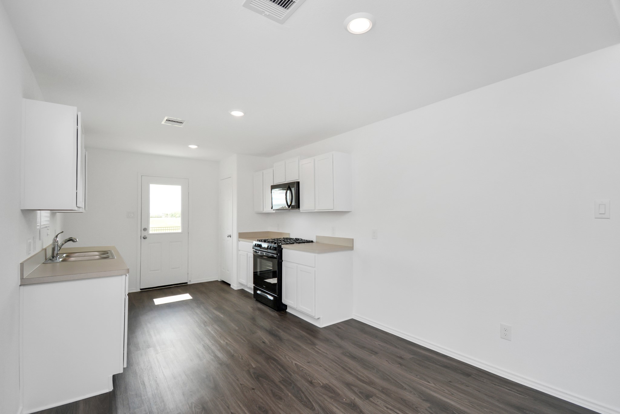 5035 Caledonia Lake Lane Rosharon, TX 77583 - Photo 29 of 37 a room with a wooden floor and a window