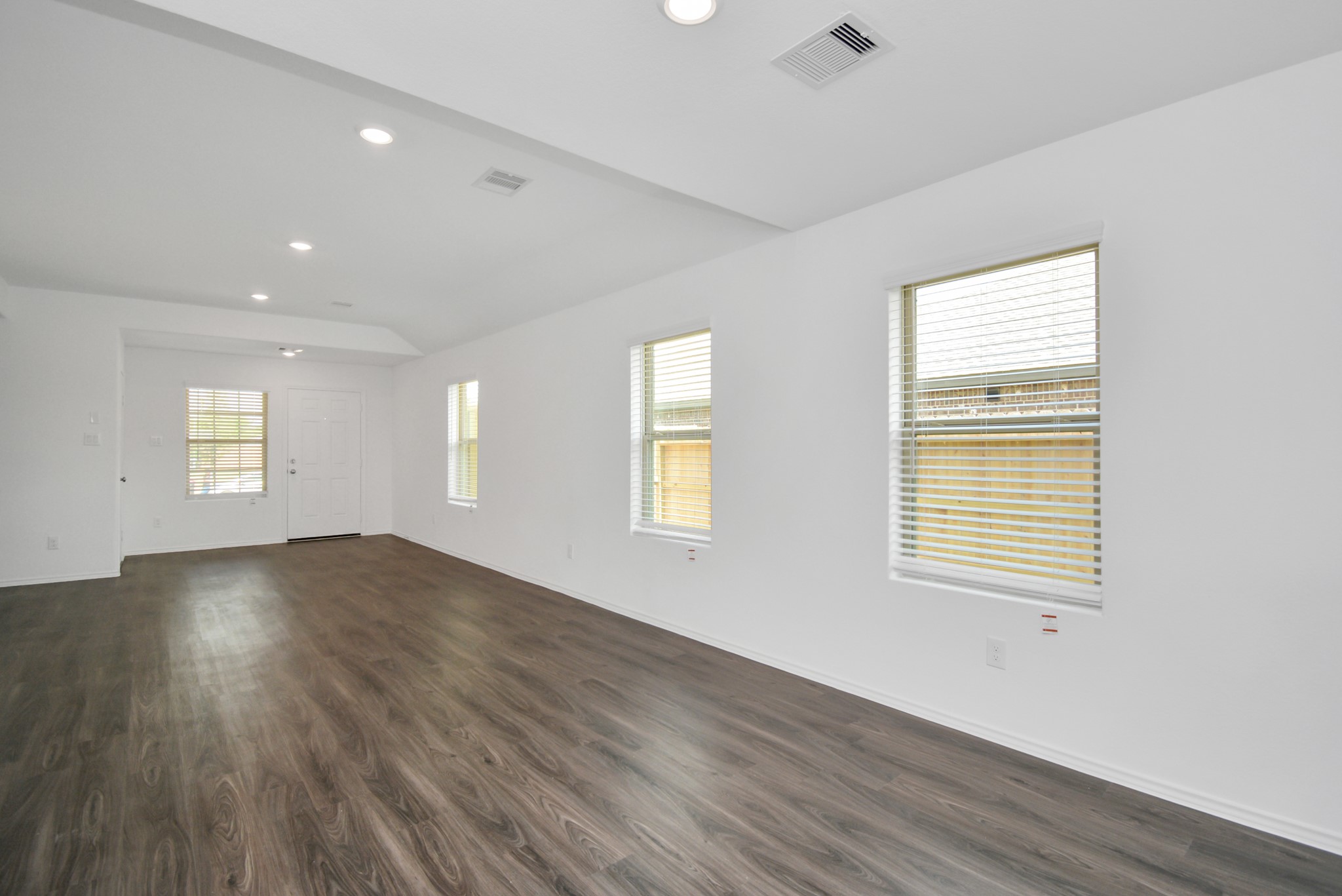 5035 Caledonia Lake Lane Rosharon, TX 77583 - Photo 32 of 37 a view of an empty room with wooden floor and a window