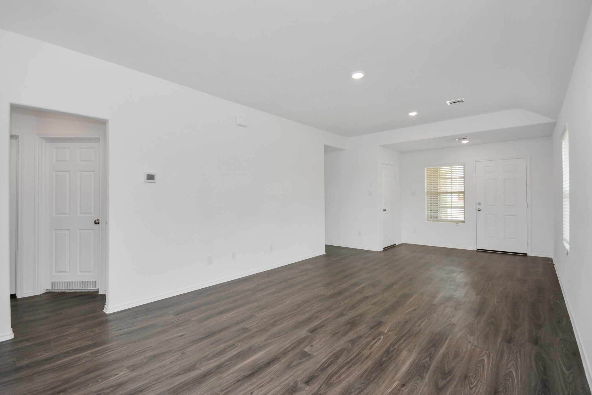 5035 Caledonia Lake Lane Rosharon, TX 77583 - Photo 33 of 37 an empty room with wooden floor and windows