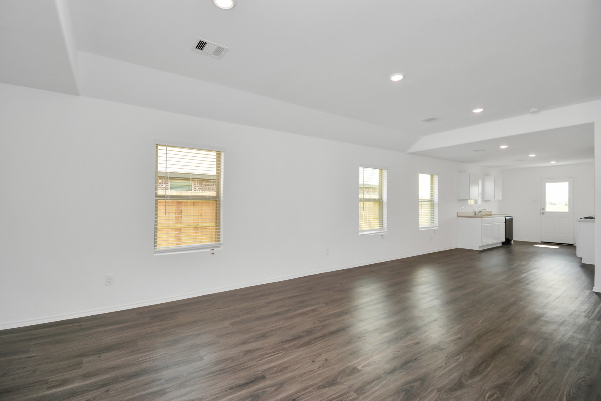 5035 Caledonia Lake Lane Rosharon, TX 77583 - Photo 35 of 37 a view of an empty room with wooden floor and a window