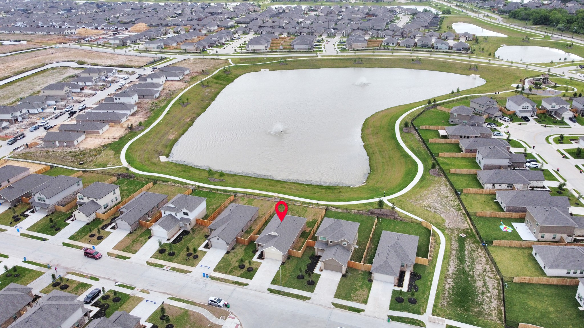 5035 Caledonia Lake Lane Rosharon, TX 77583 - Photo 37 of 37 an aerial view of a swimming pool and a terrace