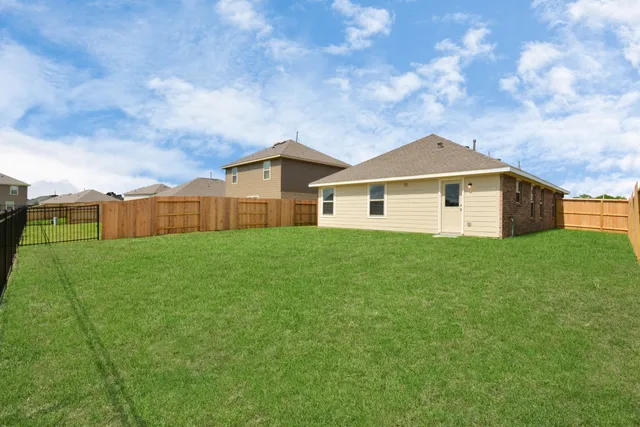 a front view of a house with yard