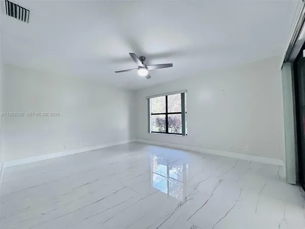 a large bathroom with a sink a large mirror and a shower