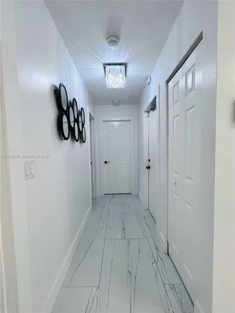 a view of kitchen with a sink and a stove top oven