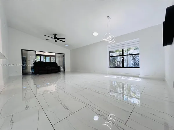 a view of livingroom with furniture and white cabinet