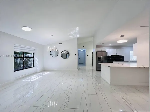 a view of a livingroom with a furniture