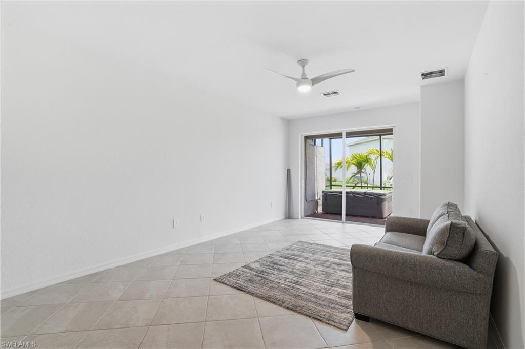 2215 Dragonfruit Way Naples, FL 34120 - Photo 6 of 38 a living room with furniture and a window
