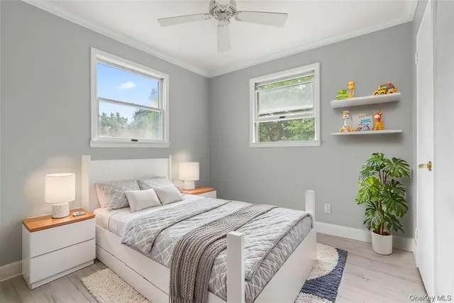a work room with furniture a rug and a window