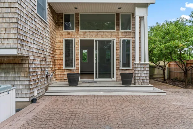 a green field with trees in the background