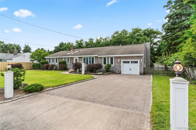 an aerial view of residential houses with outdoor space and swimming pool