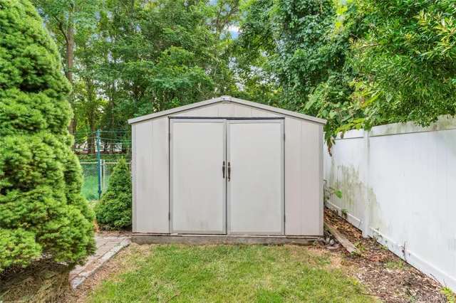a picture of a bathroom with a street sign on the wall