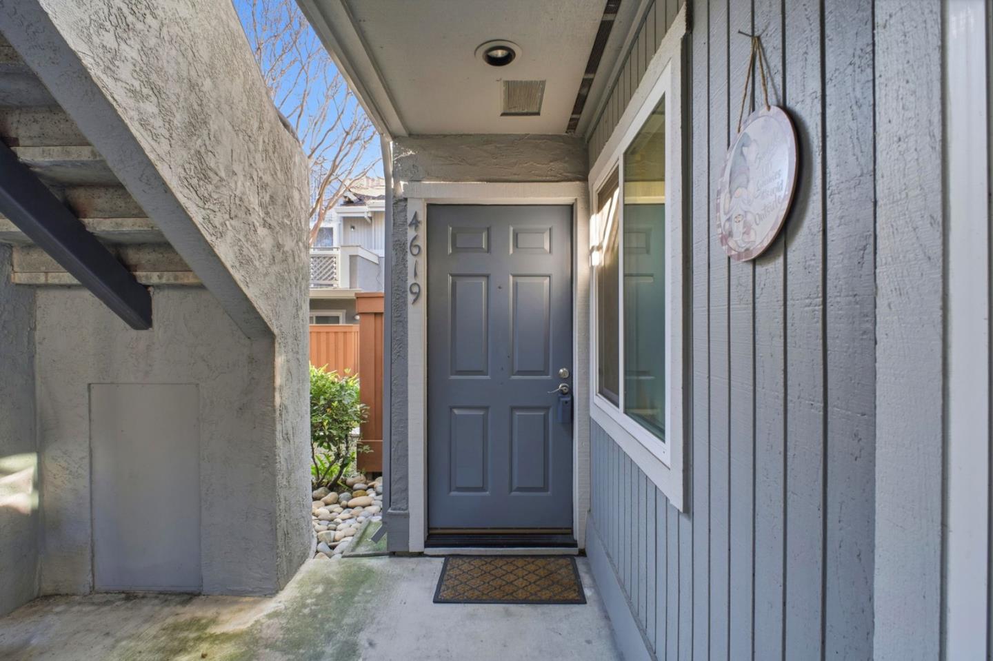 a view of a hallway with windows and stairs
