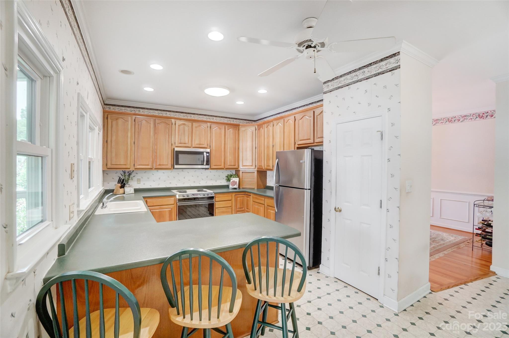 29025 Beaver Run Tega Cay, SC 29708 - Photo 13 of 42 a kitchen with stainless steel appliances granite countertop a refrigerator a sink a stove and island