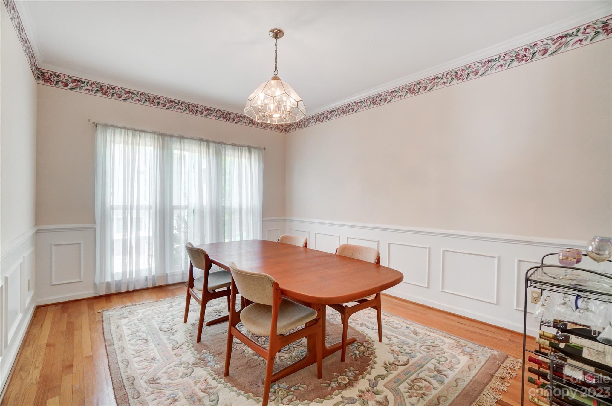 29025 Beaver Run Tega Cay, SC 29708 - Photo 15 of 42 a view of a dining room with furniture window and wooden floor