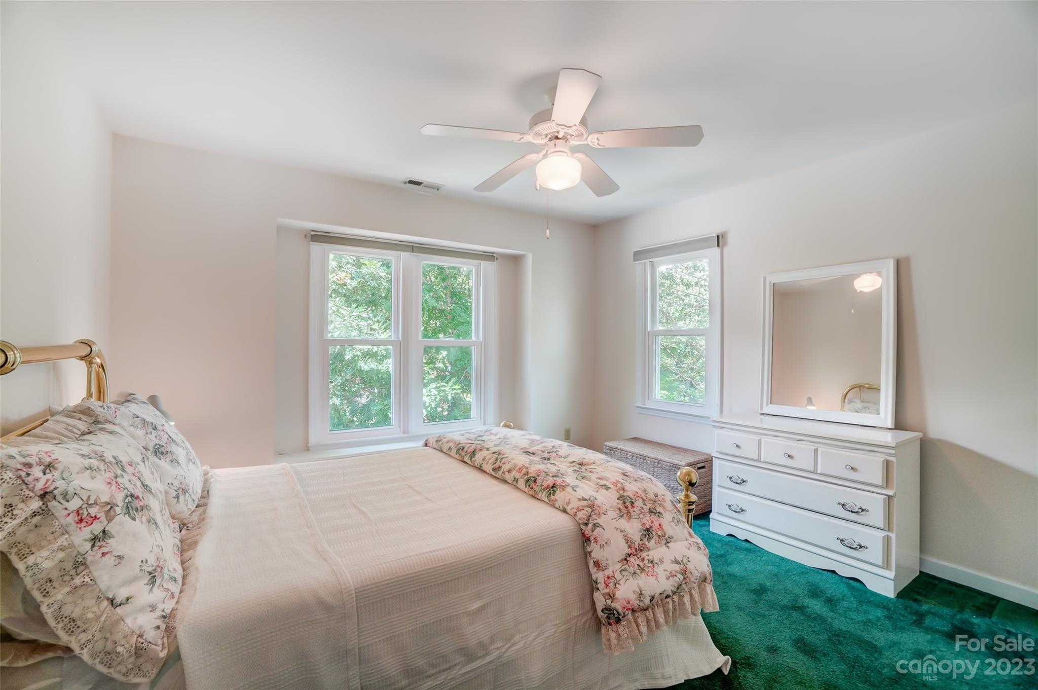 29025 Beaver Run Tega Cay, SC 29708 - Photo 24 of 42 a bedroom with a large bed and a window