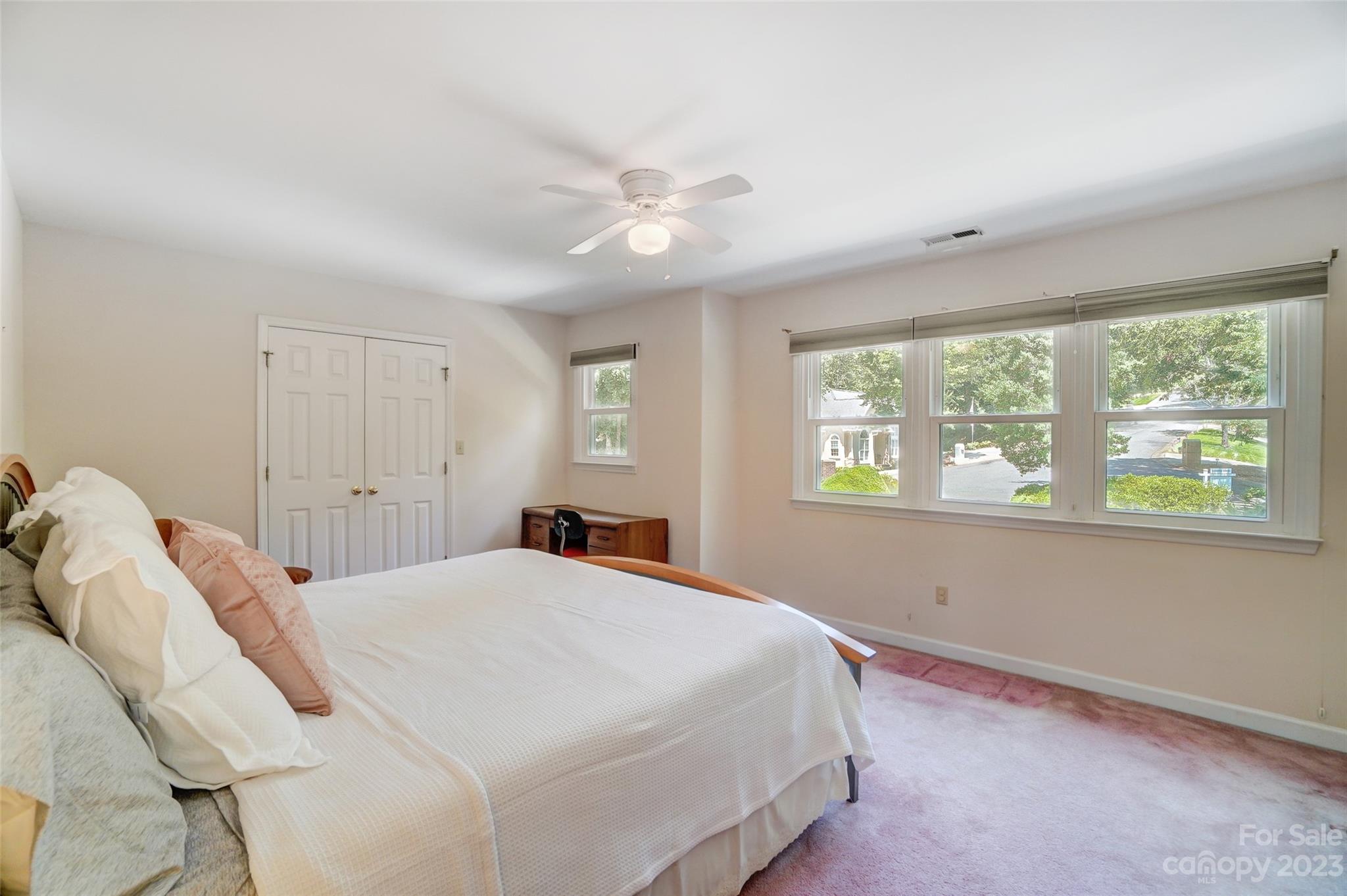 29025 Beaver Run Tega Cay, SC 29708 - Photo 27 of 42 a bedroom with a bed and a window