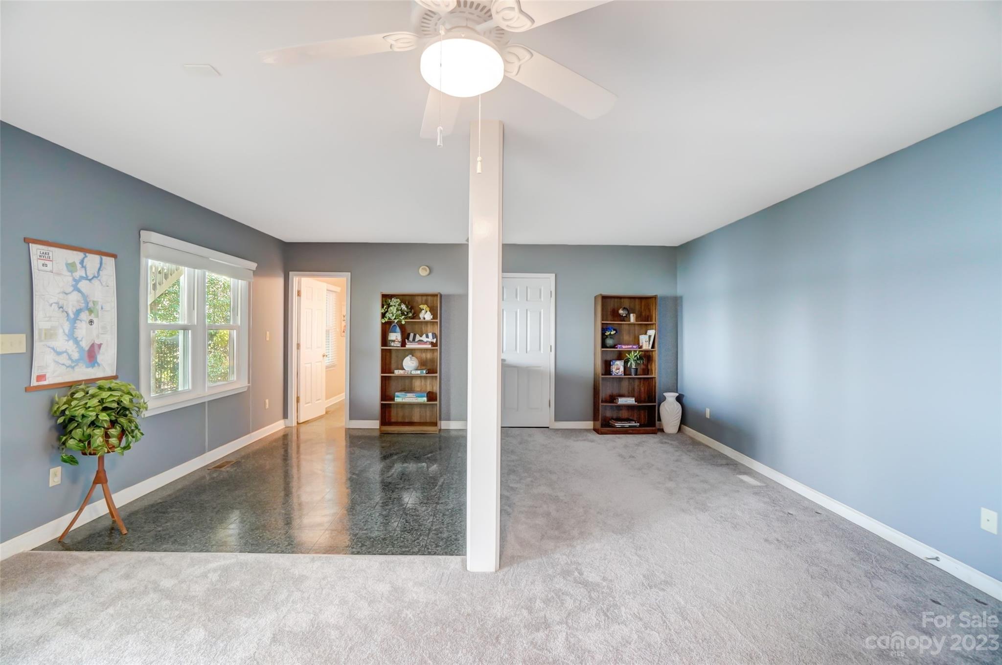 29025 Beaver Run Tega Cay, SC 29708 - Photo 32 of 42 a view of an empty room with a window and wooden floor