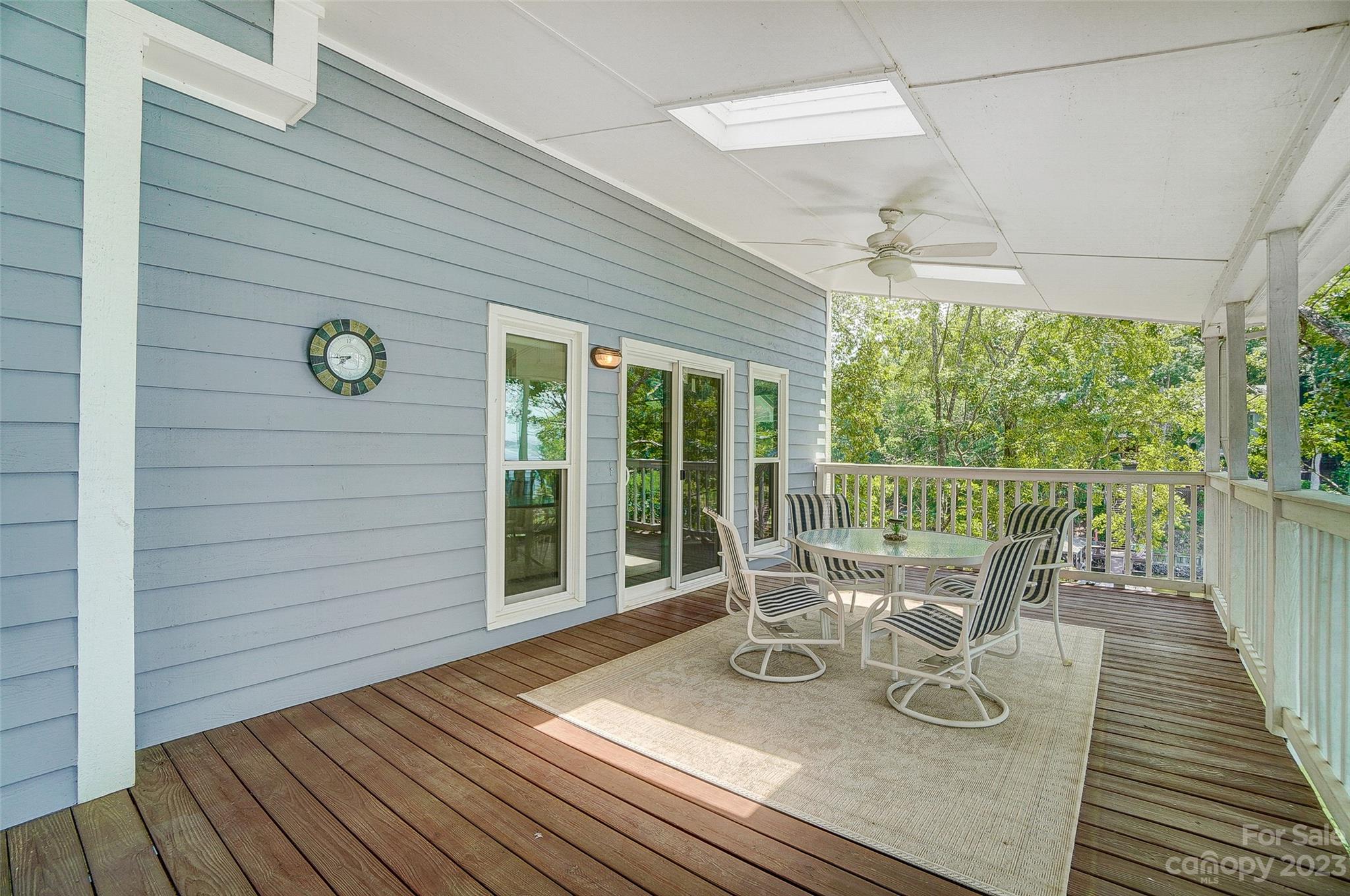 29025 Beaver Run Tega Cay, SC 29708 - Photo 36 of 42 a view of a chairs and table on the wooden deck