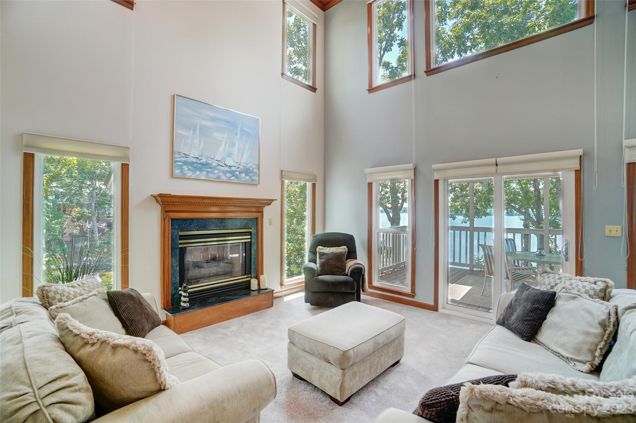 29025 Beaver Run Tega Cay, SC 29708 - Photo 8 of 42 a living room with furniture large window and a fireplace