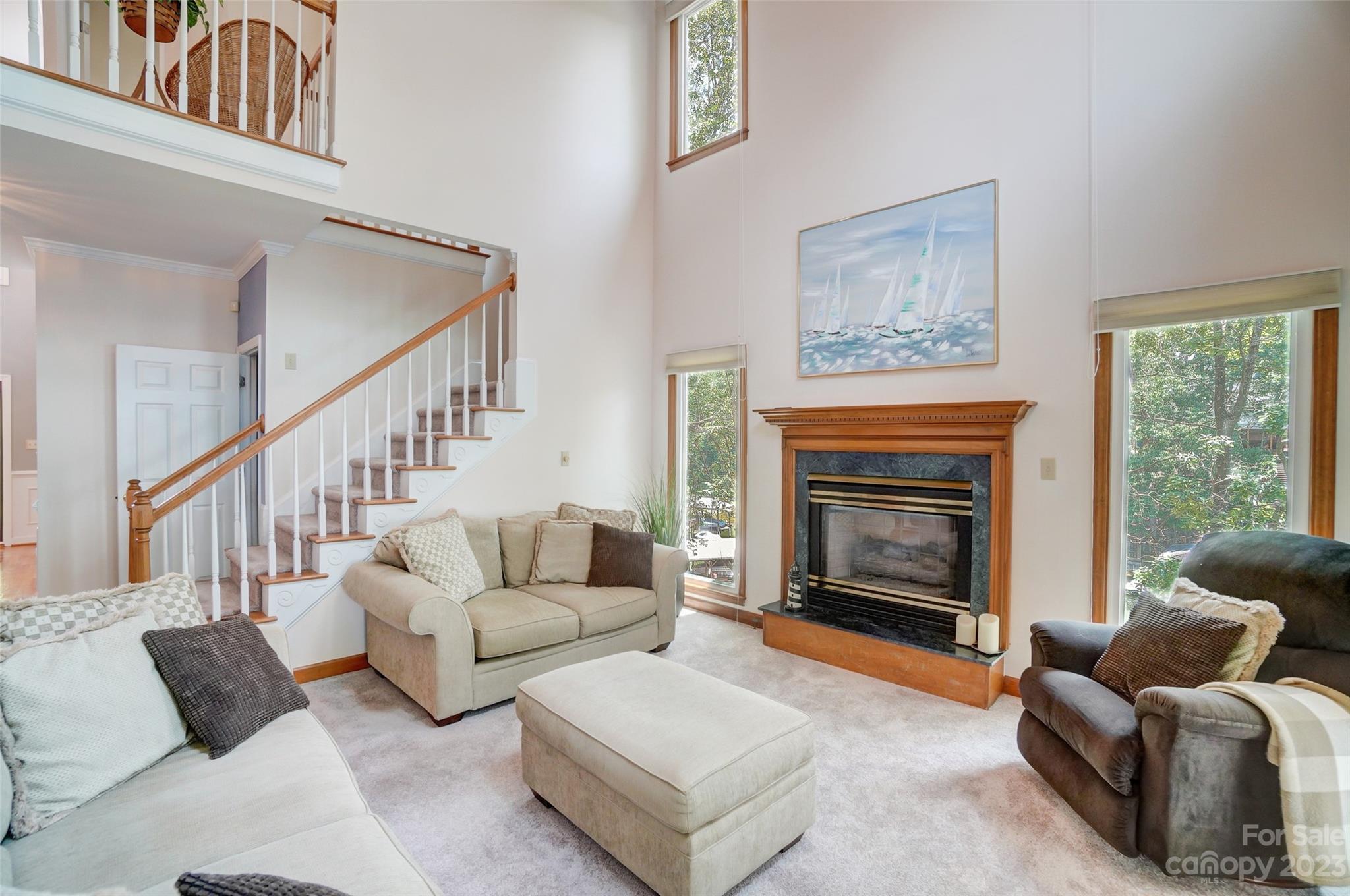 29025 Beaver Run Tega Cay, SC 29708 - Photo 9 of 42 a living room with furniture and a fireplace
