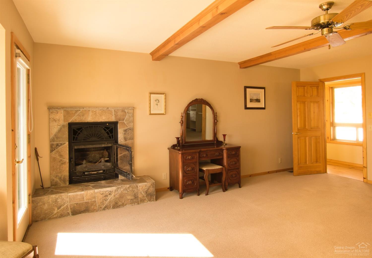 17231 Mountain View Road Sisters, OR 97759 - Photo 14 of 22 Master bedroom has its own fireplace.