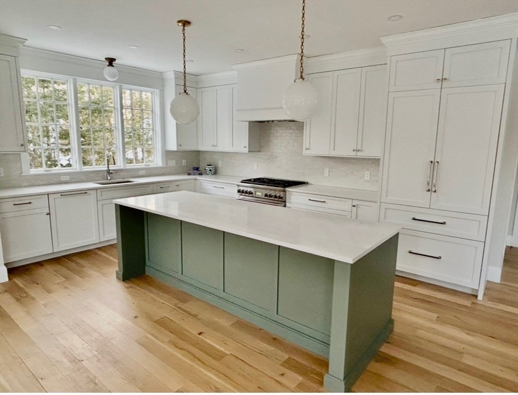 36 Yorkshire Road Dover, MA 02030 - Photo 4 of 9 a kitchen with stainless steel appliances granite countertop a sink stove and refrigerator