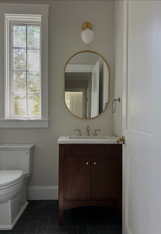 36 Yorkshire Road Dover, MA 02030 - Photo 7 of 9 a bathroom with a toilet sink and mirror