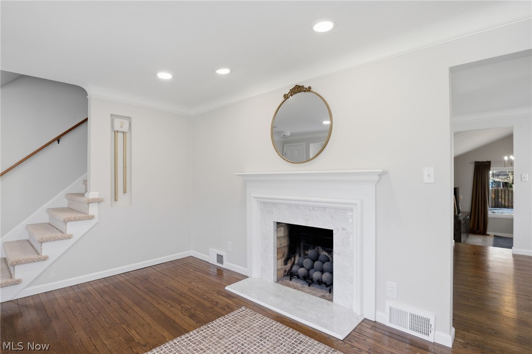 1390 Brainard Road Lyndhurst, OH 44124 - Photo 4 of 33 Unfurnished living room with dark wood-style flooring, a fireplace, and recessed lighting