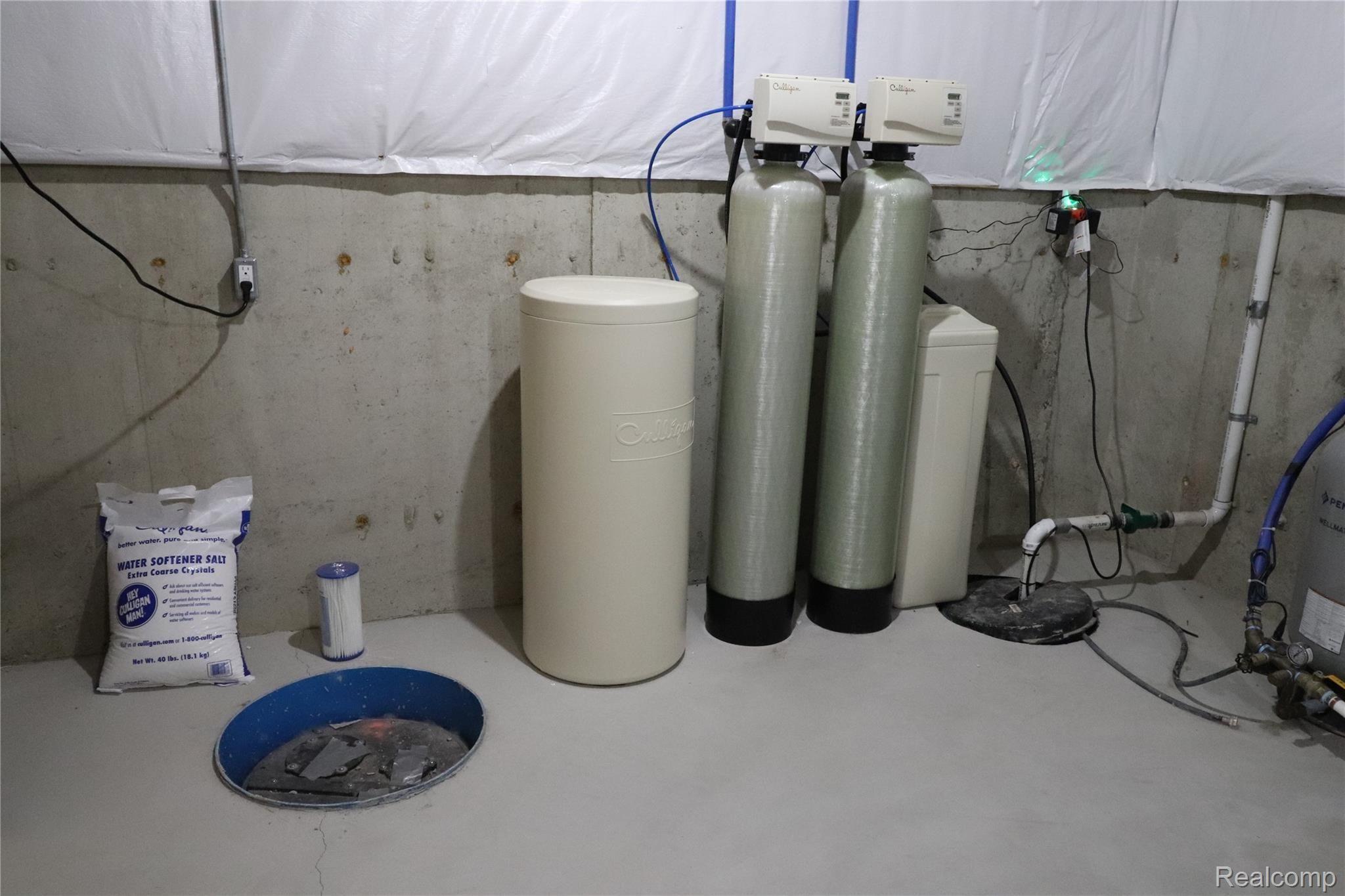 65777 Mound Road Washington, MI 48095 - Photo 37 of 45 Prepped For Bathroom In Basement - Water Softener - Sump Pump