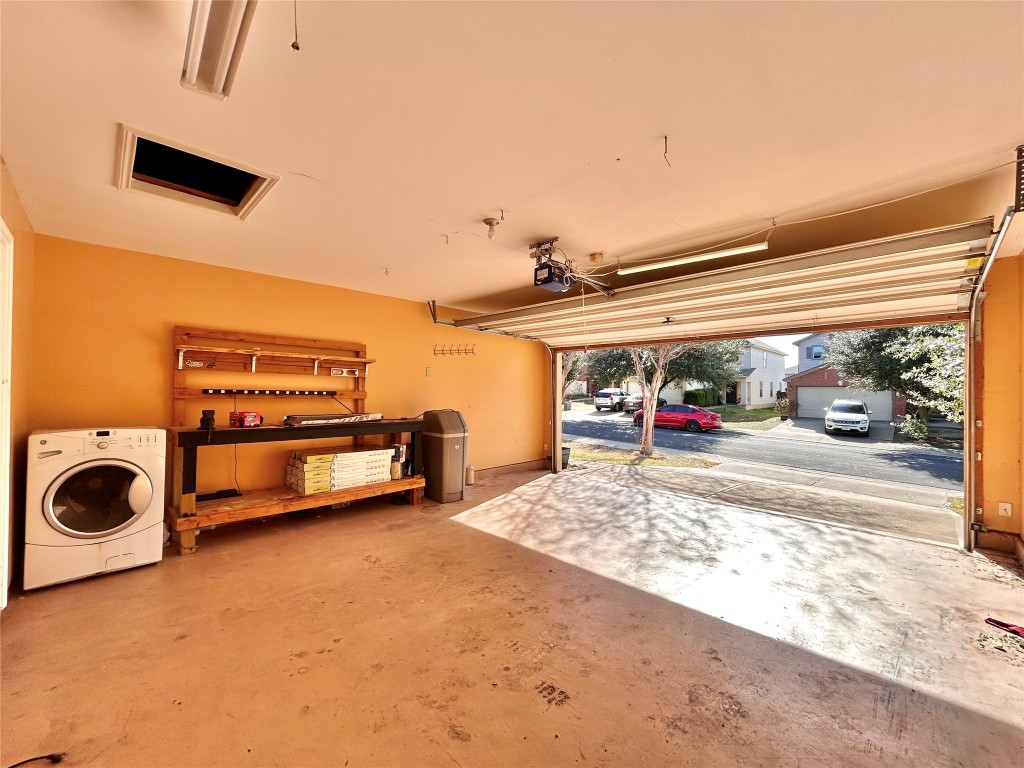 2011 Ashberry Trail Georgetown, TX 78626 - Photo 20 of 24 Garage with washer / clothes dryer