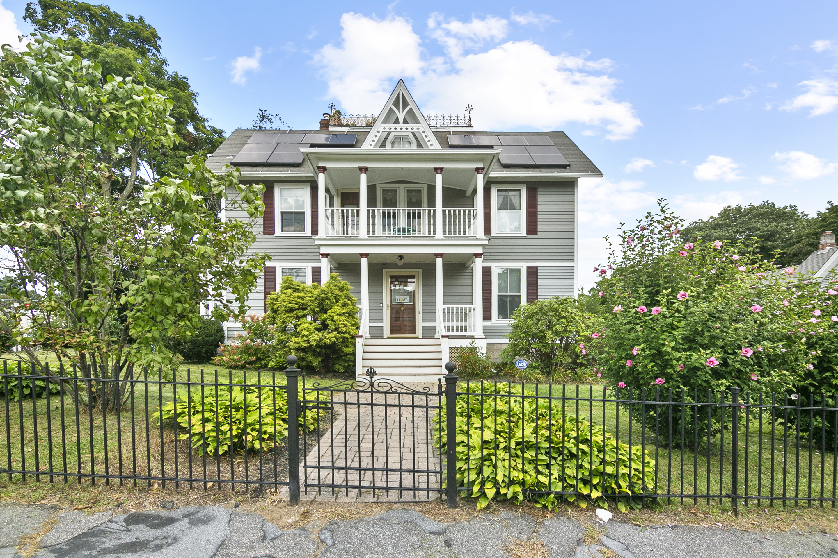 76 Cook Street Torrington, CT 06790 - Photo 1 of 1 Front with Wrought Iron fence