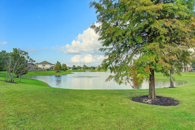 a view of a lake with a yard