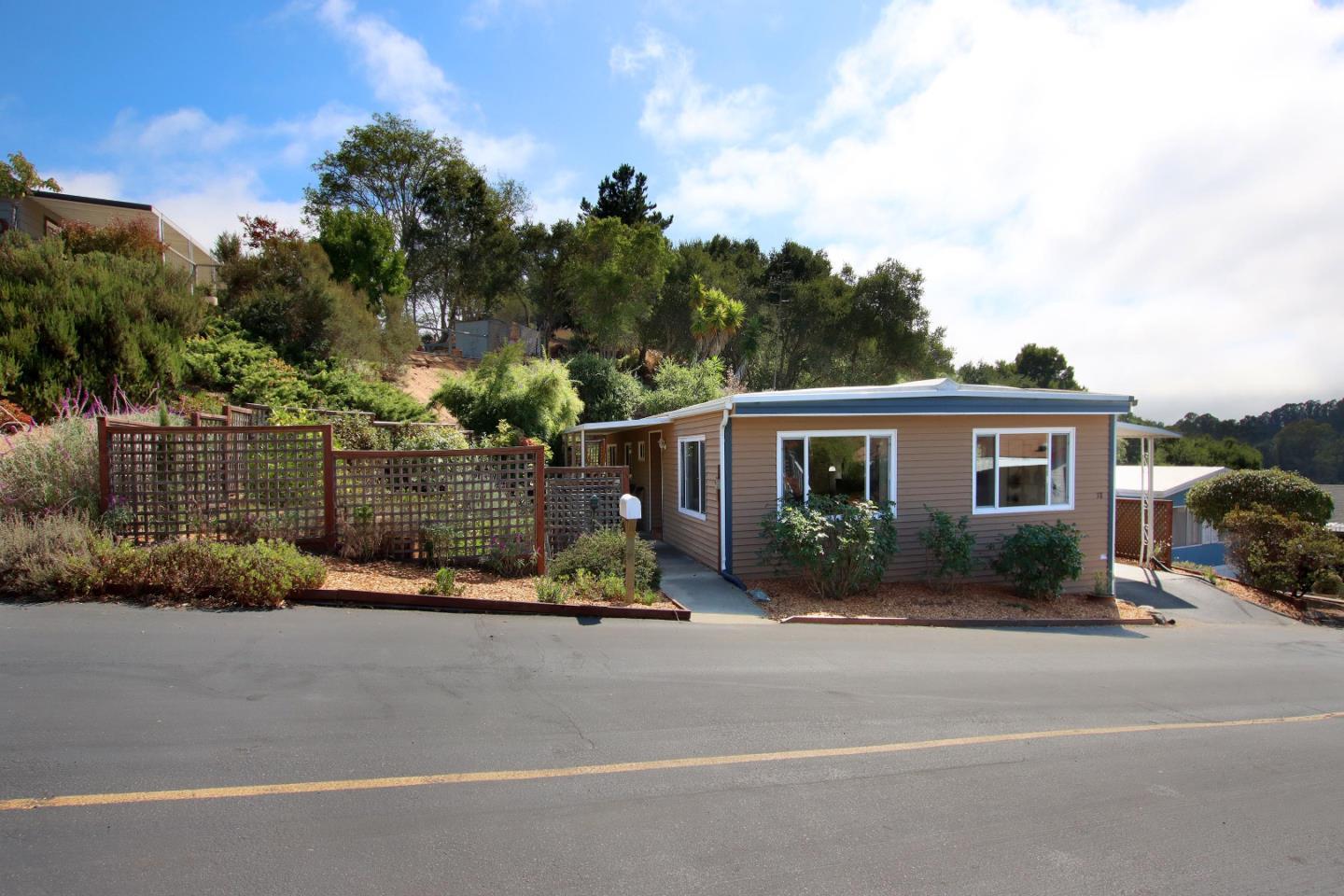 a view of a house with a cars park