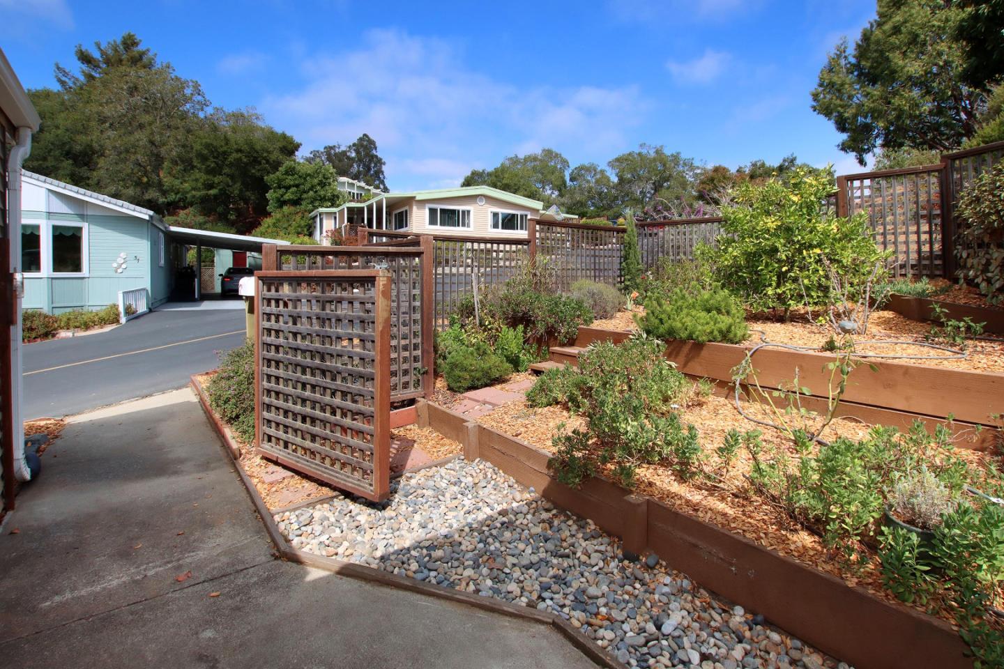 270 Hames Road, Unit 38 Corralitos, CA 95076 - Photo 3 of 35 a pathway of a house with a yard