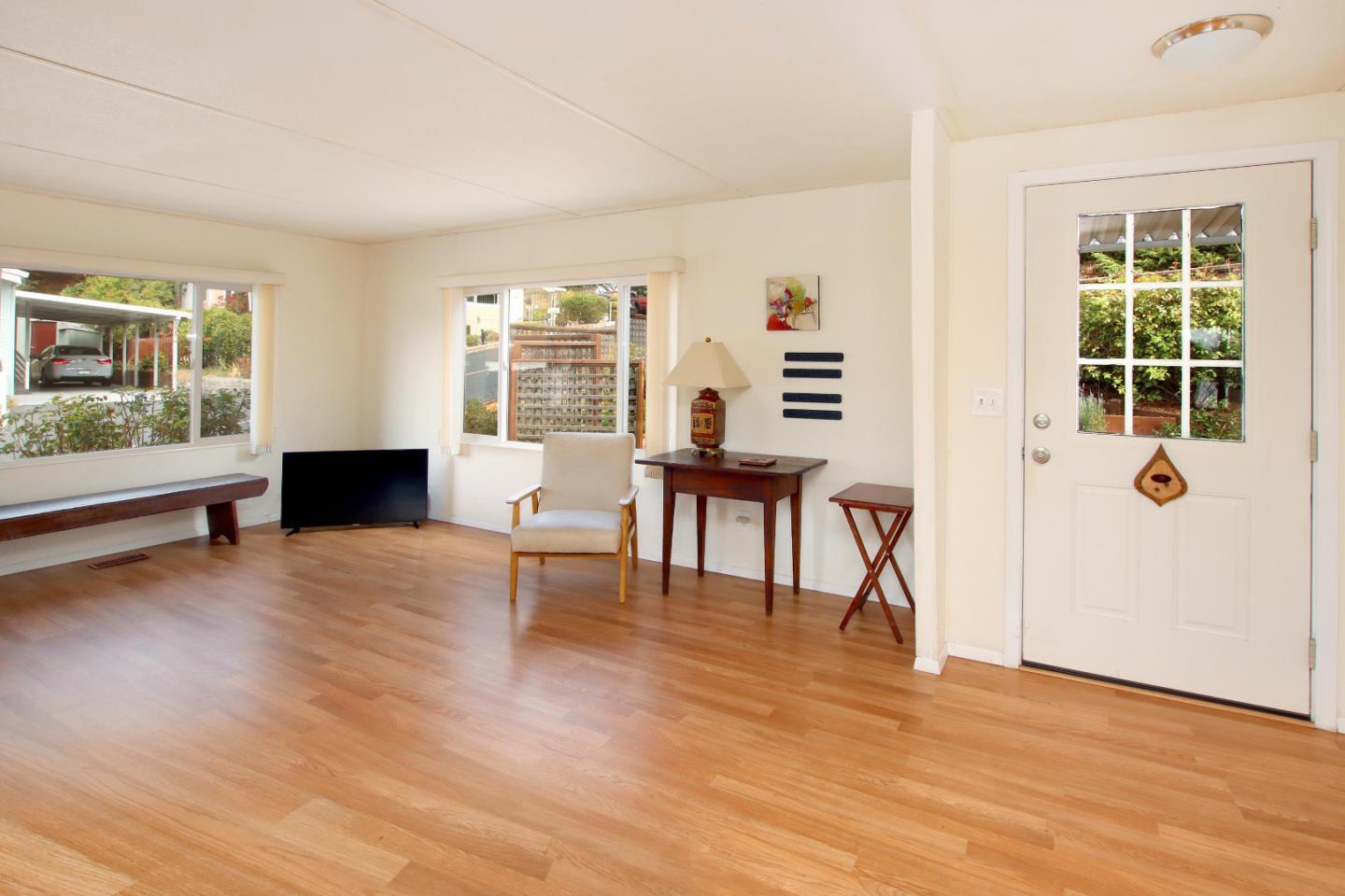 270 Hames Road, Unit 38 Corralitos, CA 95076 - Photo 6 of 35 a living room with furniture and a wooden floor