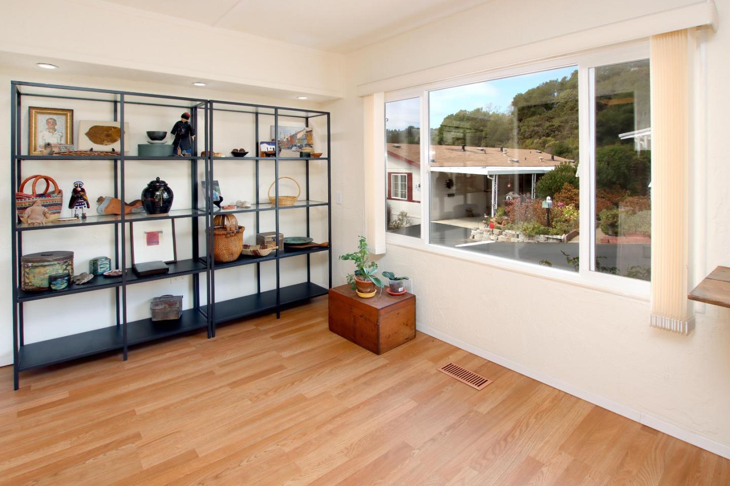270 Hames Road, Unit 38 Corralitos, CA 95076 - Photo 10 of 35 a living room with furniture and a floor to ceiling window