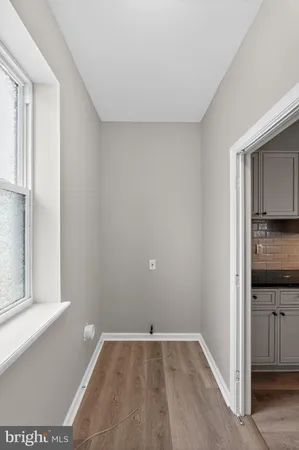a view of a kitchen cabinets and empty room