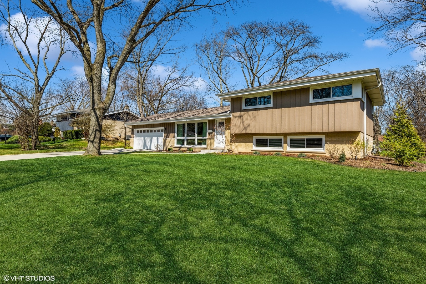 1755 Winthrop Road Highland Park, IL 60035 - Photo 1 of 15 a view of a house with a yard and sitting area