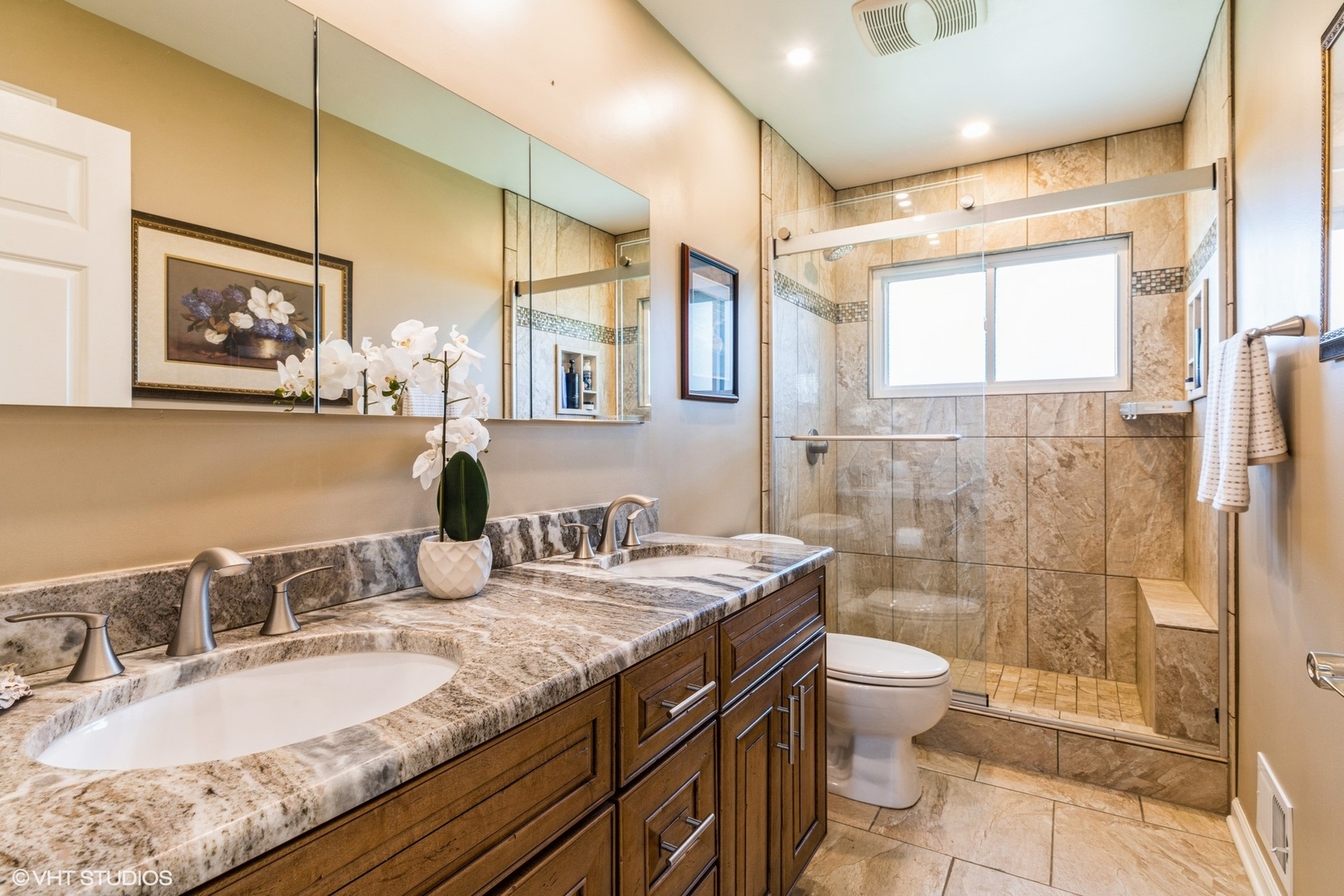 1755 Winthrop Road Highland Park, IL 60035 - Photo 7 of 15 a bathroom with a granite countertop sink a toilet a mirror and shower