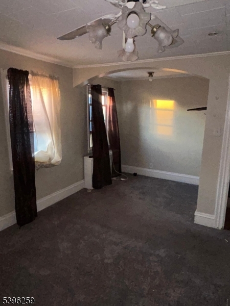 114 Ely Street Elizabeth, NJ 07202 - Photo 9 of 13 an empty room with windows and closet