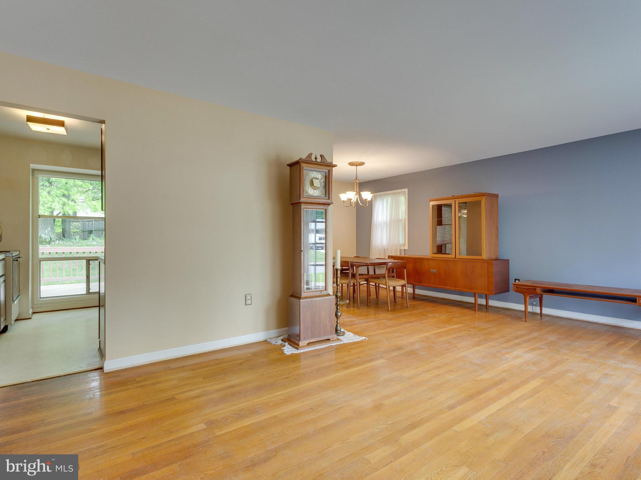 8207 Old Oaks Drive Springfield, VA 22152 - Photo 2 of 30 a view of an empty room with window and wooden floor