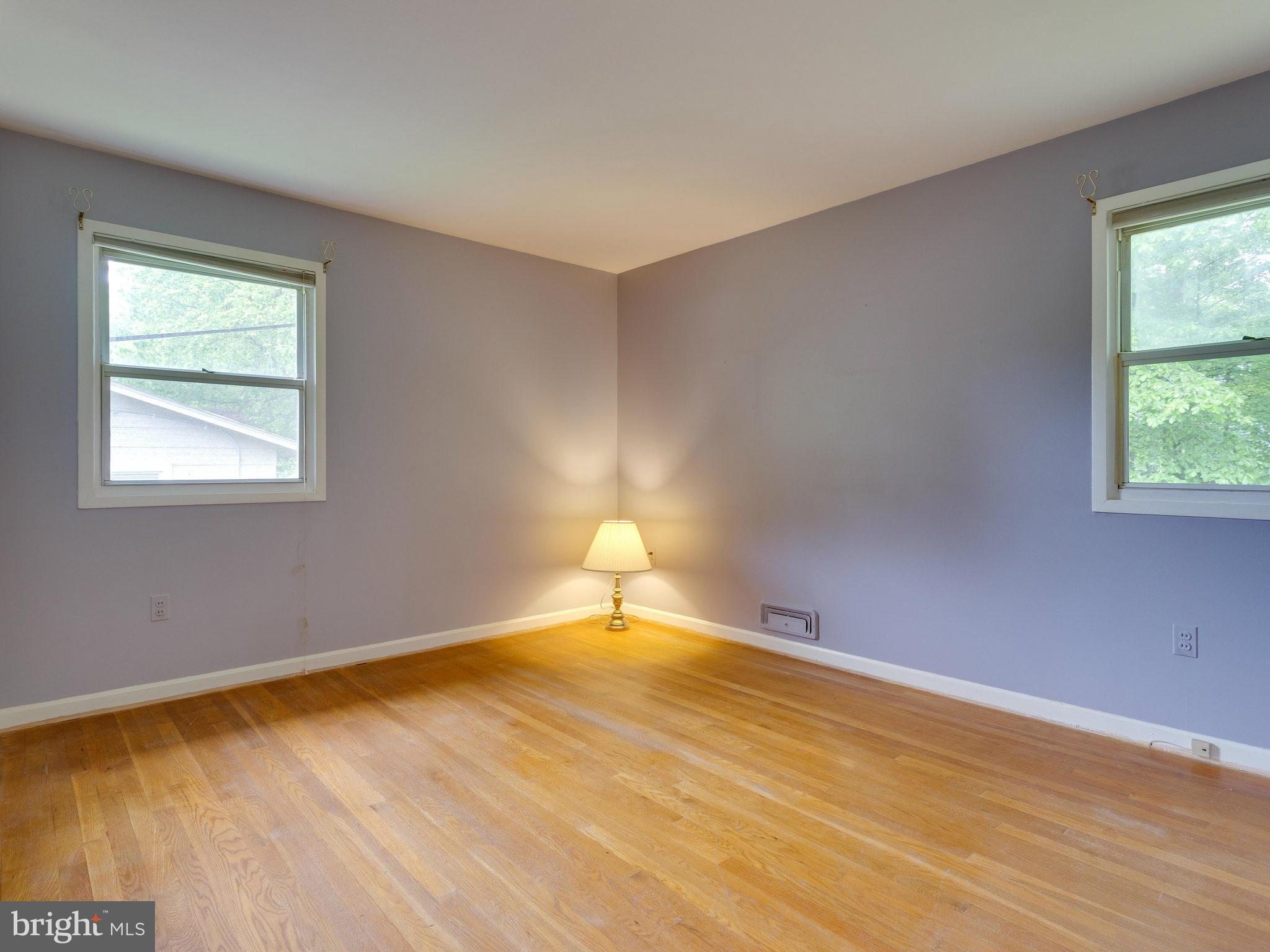 8207 Old Oaks Drive Springfield, VA 22152 - Photo 17 of 30 a room with a window and a lamp