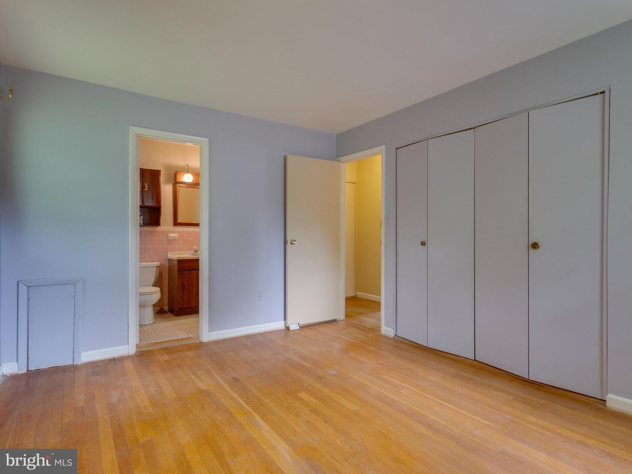 8207 Old Oaks Drive Springfield, VA 22152 - Photo 19 of 30 a view of empty room with wooden floor