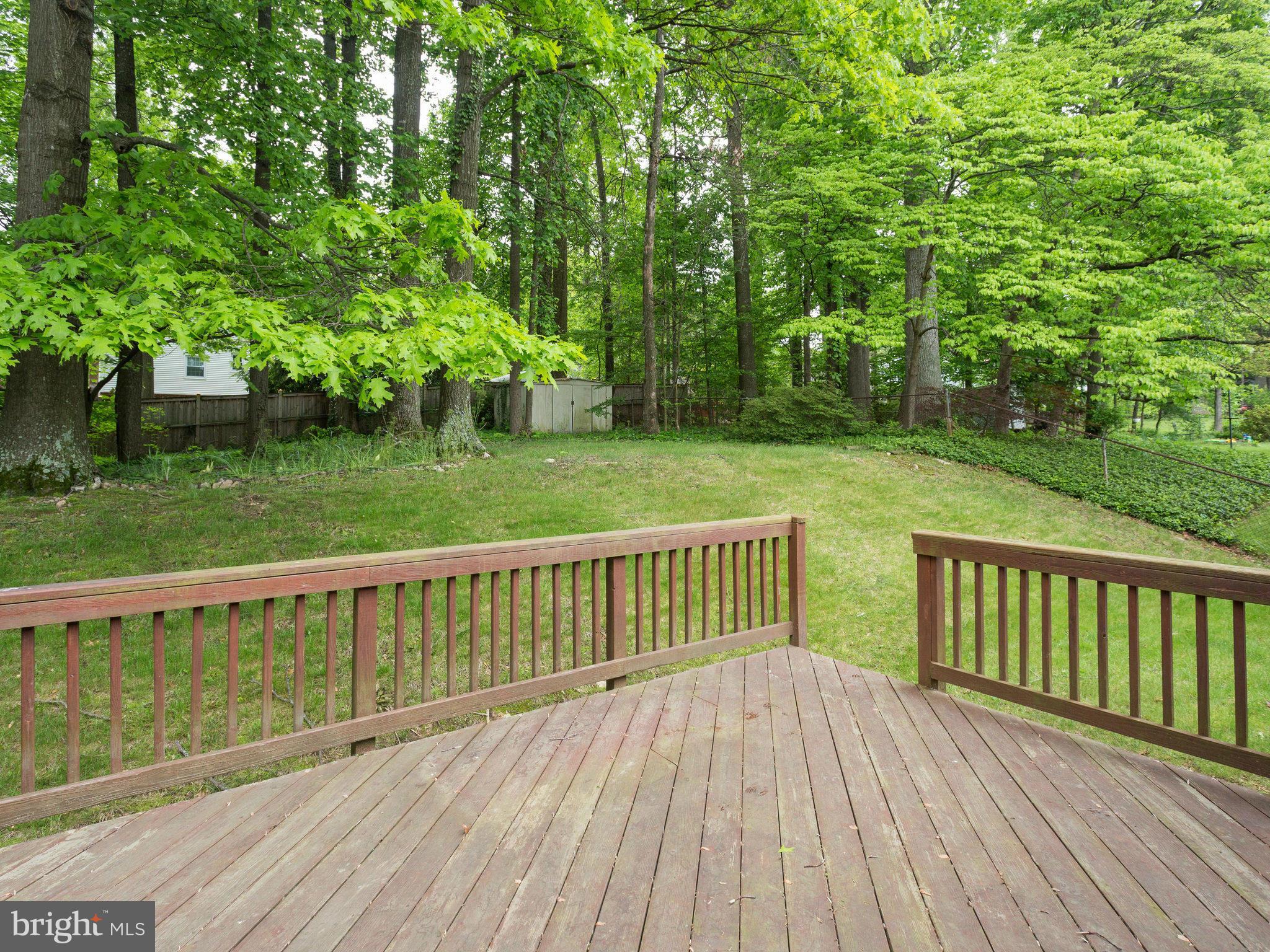 8207 Old Oaks Drive Springfield, VA 22152 - Photo 25 of 30 a view of balcony with wooden floor and fence