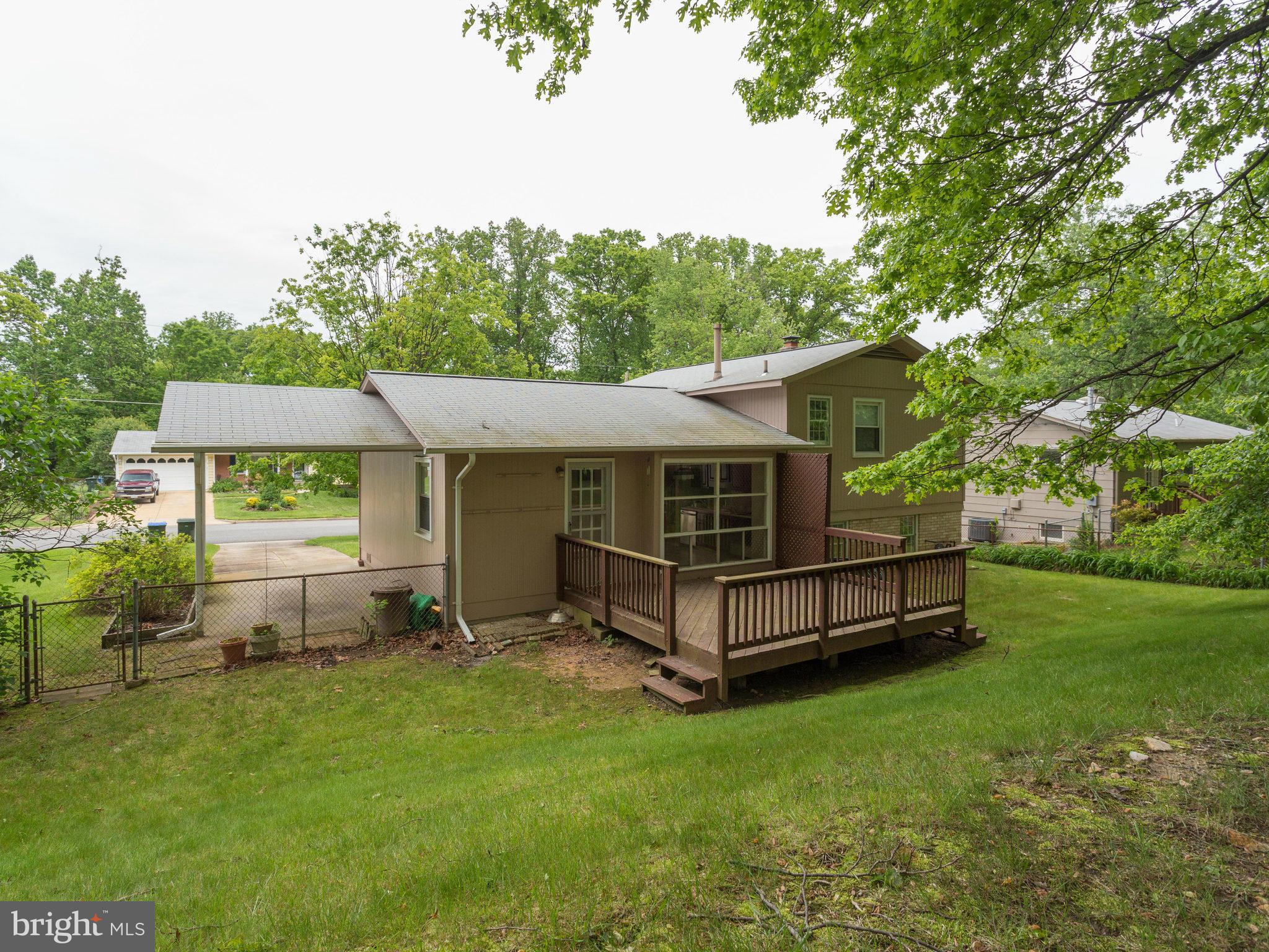 8207 Old Oaks Drive Springfield, VA 22152 - Photo 28 of 30 a view of a house with a yard and sitting area