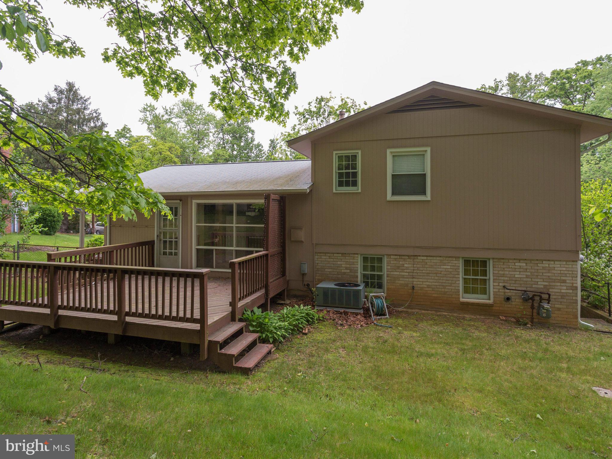 8207 Old Oaks Drive Springfield, VA 22152 - Photo 29 of 30 a view of a house with a yard and furniture
