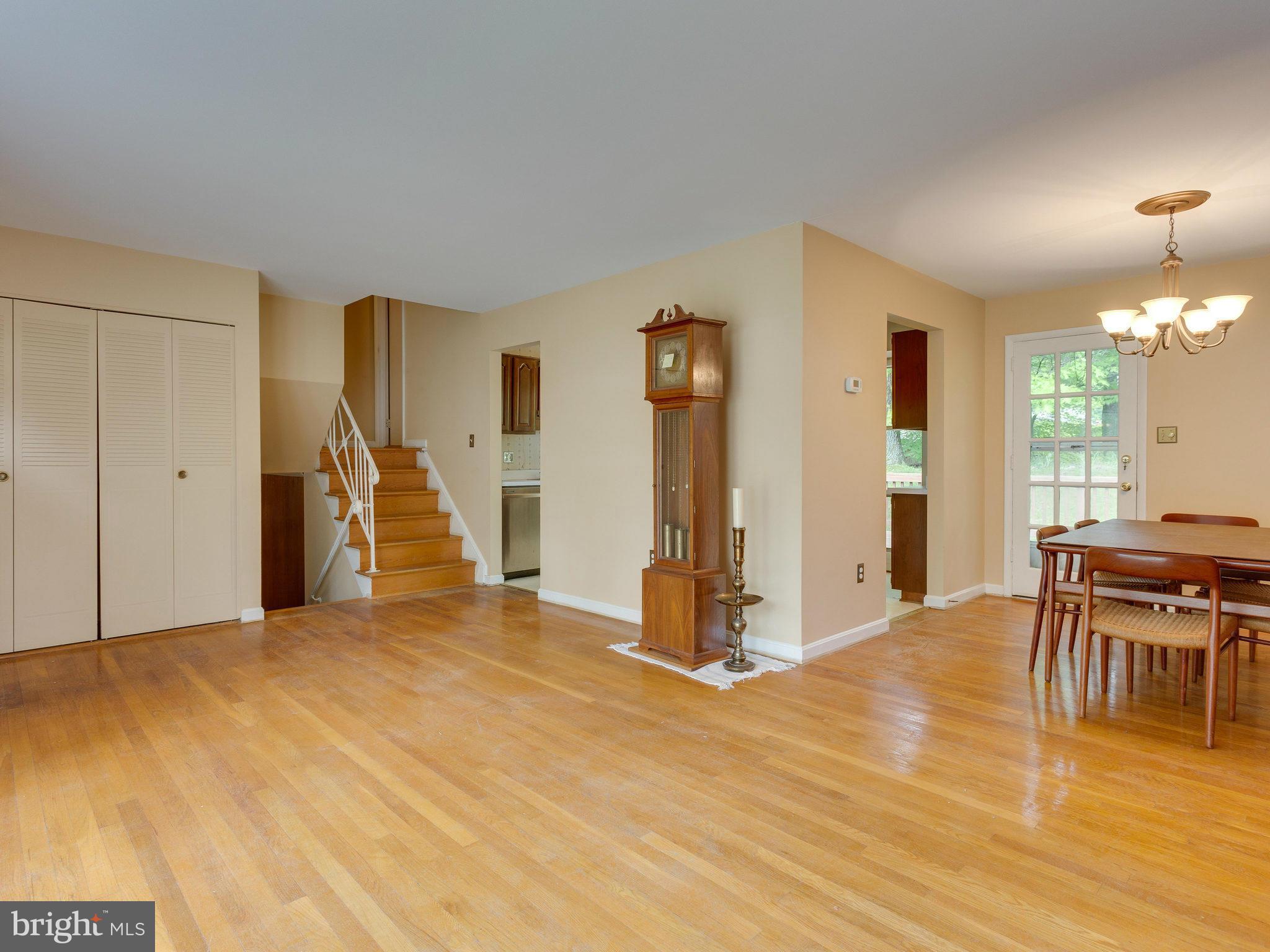 8207 Old Oaks Drive Springfield, VA 22152 - Photo 4 of 30 a view of a livingroom with furniture wooden floor and ceiling fan