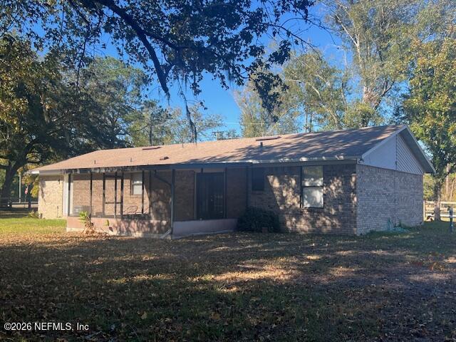312 East Market Road Starke, FL 32091 - Photo 16 of 46 a view of a house with a yard